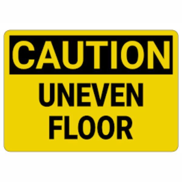 "Warning sign for uneven floor surface in commercial building"