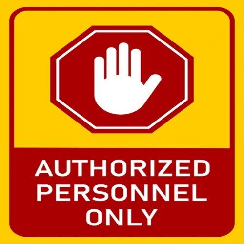 Wall-mounted "Authorized Personnel Only" sign in Nigeria.
